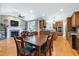 Inviting living space featuring a dining table, fireplace and open access to the gourmet kitchen at 9048 Chelsea Dr, Raleigh, NC 27603