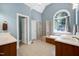 This main bathroom has double vanity sinks, soaking tub and glass shower at 9048 Chelsea Dr, Raleigh, NC 27603