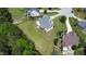 Expansive backyard with verdant lawn and screened porch, perfect for outdoor living and entertaining at 100 S Sunset Ridge Dr, Willow Springs, NC 27592