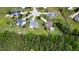 Aerial view showcases homes nestled within a lush, green neighborhood, offering serene suburban living at 100 S Sunset Ridge Dr, Willow Springs, NC 27592