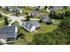 Aerial shot featuring a home with a large backyard, screened porch, and lush tree line for added privacy at 100 S Sunset Ridge Dr, Willow Springs, NC 27592