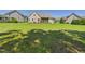 Green backyard showcasing the home's exterior and outdoor space for recreation and relaxation at 100 S Sunset Ridge Dr, Willow Springs, NC 27592