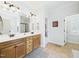 Bathroom featuring double sinks, tiled floors, and separate vanity at 100 S Sunset Ridge Dr, Willow Springs, NC 27592