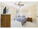 Cozy bedroom featuring a ceiling fan, carpet, and ample natural light at 100 S Sunset Ridge Dr, Willow Springs, NC 27592