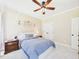 Bedroom featuring a ceiling fan, carpet, and ample natural light at 100 S Sunset Ridge Dr, Willow Springs, NC 27592