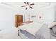 Bright bedroom featuring a ceiling fan, tray ceiling, and neutral color scheme at 100 S Sunset Ridge Dr, Willow Springs, NC 27592