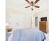 Comfortable bedroom features a ceiling fan, and a spacious closet for optimal storage at 100 S Sunset Ridge Dr, Willow Springs, NC 27592