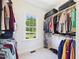 Walk-in closet with clothing racks, shelves, and storage; window view at 100 S Sunset Ridge Dr, Willow Springs, NC 27592