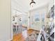 Inviting foyer with hardwood floors, decorative rug, and a view of the dining area at 100 S Sunset Ridge Dr, Willow Springs, NC 27592