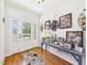 Welcoming foyer area featuring hardwood floors, a decorative rug, and ample wall decor at 100 S Sunset Ridge Dr, Willow Springs, NC 27592