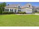 Well-maintained home featuring a neatly landscaped yard and classic architectural details at 100 S Sunset Ridge Dr, Willow Springs, NC 27592