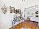 Hallway with hardwood floors, white trim, and decorated console table at 100 S Sunset Ridge Dr, Willow Springs, NC 27592