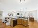 Open-concept kitchen with modern appliances overlooking a living area and a dining table at 100 S Sunset Ridge Dr, Willow Springs, NC 27592