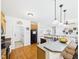 Kitchen with granite countertops and hardwood floors, open to other living spaces at 100 S Sunset Ridge Dr, Willow Springs, NC 27592
