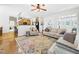 Cozy living room with hardwood floors, lots of light, and access to other rooms at 100 S Sunset Ridge Dr, Willow Springs, NC 27592