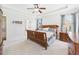 Comfortable main bedroom with a tray ceiling, featuring a large bed and a window with natural light at 100 S Sunset Ridge Dr, Willow Springs, NC 27592