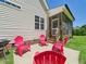Outdoor patio with bright-colored seating, perfect for entertaining and enjoying the backyard at 100 S Sunset Ridge Dr, Willow Springs, NC 27592