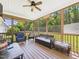 Inviting screened-in porch featuring comfortable seating and a ceiling fan for relaxing outdoors at 100 S Sunset Ridge Dr, Willow Springs, NC 27592