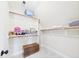 Walk-in closet with custom shelving and a storage chest at 100 S Sunset Ridge Dr, Willow Springs, NC 27592