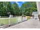 Lovely back deck with white railings and a spacious area for outdoor relaxation at 10031 Old Middlesex Rd, Middlesex, NC 27557