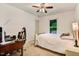 Comfortable bedroom with a ceiling fan, study desk, and a relaxing space at 10031 Old Middlesex Rd, Middlesex, NC 27557