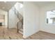Bright entryway featuring hardwood floors, staircase with iron railings, and a large window for natural light at 1009 Parker St, Raleigh, NC 27607