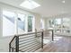 Bright hallway features hardwood floors, skylight, and large windows at 1009 Parker St, Raleigh, NC 27607