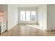 Spacious living area showcasing hardwood floors and windows offering ample natural light at 1009 Parker St, Raleigh, NC 27607