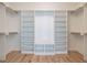Organized walk-in closet with custom shelves and racks, perfect for maximizing storage and keeping your wardrobe in order at 1009 Parker St, Raleigh, NC 27607