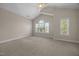 Bright bedroom with a vaulted ceiling, and abundant natural light from large windows at 1012 Palace Garden Way, Raleigh, NC 27603