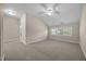 Spacious bedroom with neutral carpeting, vaulted ceiling, and sun-drenched windows at 1012 Palace Garden Way, Raleigh, NC 27603