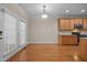 Dining room with hardwood floors, neutral paint and wood cabinets with stainless steel appliances at 1012 Palace Garden Way, Raleigh, NC 27603