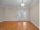 Dining room featuring hardwood floors, neutral paint and double doors with window shutters at 1012 Palace Garden Way, Raleigh, NC 27603