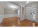 Spacious foyer with hardwood floors, leading into a dining room, creating an inviting atmosphere at 1012 Palace Garden Way, Raleigh, NC 27603