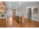Spacious kitchen with stainless steel appliances and a large island and hardwood floors at 1012 Palace Garden Way, Raleigh, NC 27603