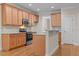 Kitchen featuring wooden cabinets and granite countertops with stainless steel appliances at 1012 Palace Garden Way, Raleigh, NC 27603