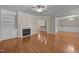 Spacious living room with a fireplace and hardwood floors, flowing seamlessly into other living areas at 1012 Palace Garden Way, Raleigh, NC 27603