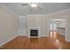 Comfortable living room with built-in shelving, a fireplace, and an open layout for entertaining at 1012 Palace Garden Way, Raleigh, NC 27603