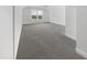 Cozy bedroom with plush carpeting, ceiling fan, and bright natural light at 1092 Adams Point Dr, Garner, NC 27529