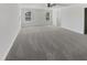 Spacious bedroom with plush carpeting, ceiling fan, and bright natural light at 1092 Adams Point Dr, Garner, NC 27529