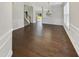 Elegant living room with hardwood floors and wainscoting detail bathed in natural light at 1092 Adams Point Dr, Garner, NC 27529