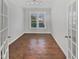 Sunlit office with hardwood floors, glass doors, and crisp white trim at 1092 Adams Point Dr, Garner, NC 27529