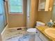 Bathroom with marble floors, toilet, shower/tub, and granite countertops at 120 W Front St, Oxford, NC 27565
