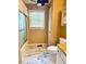 Bathroom with marble floors, toilet, shower/tub, and granite countertops at 120 W Front St, Oxford, NC 27565