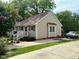 Inviting one-story home with well-maintained lawn and a driveway leading to the side of the house at 120 W Front St, Oxford, NC 27565