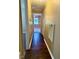 Hallway with wood flooring, a closet, and access to the bedroom at 120 W Front St, Oxford, NC 27565