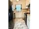 Bright kitchen with stainless steel appliances, marble floors, and ample counter space at 120 W Front St, Oxford, NC 27565