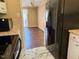 Kitchen featuring modern appliances, granite countertops, and an open floor plan at 120 W Front St, Oxford, NC 27565