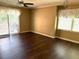 Spacious living room with hardwood floors, lots of light, and sliding glass doors at 120 W Front St, Oxford, NC 27565