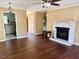 Cozy living room with fireplace, hardwood floors, and ample natural light at 120 W Front St, Oxford, NC 27565